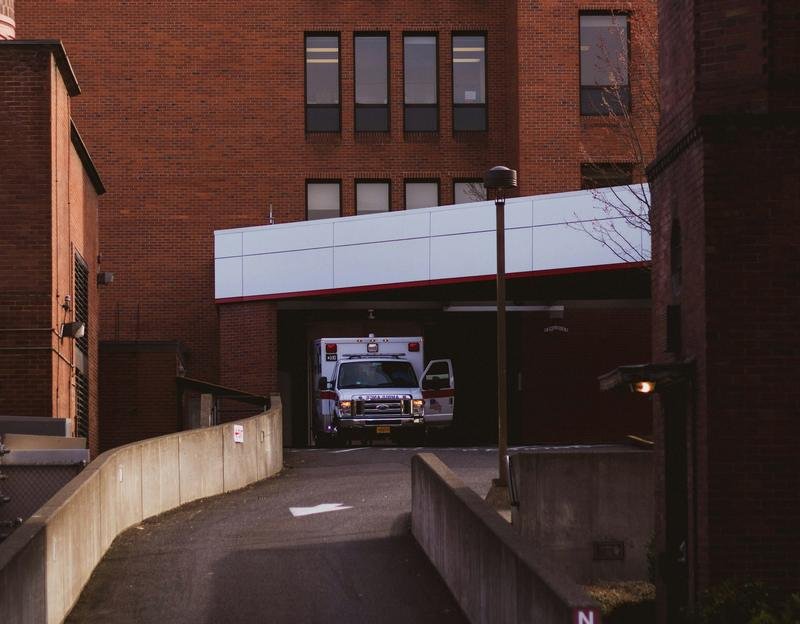 An ambulance parked in a hospital bay