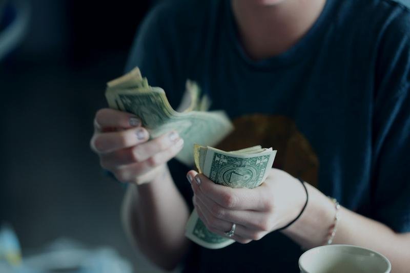 Hands counting banknotes