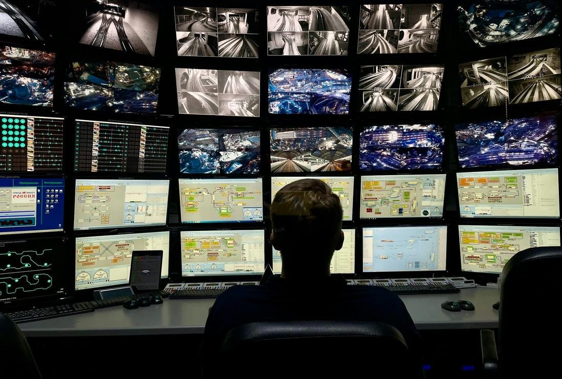 An operator watching a wall of monitors